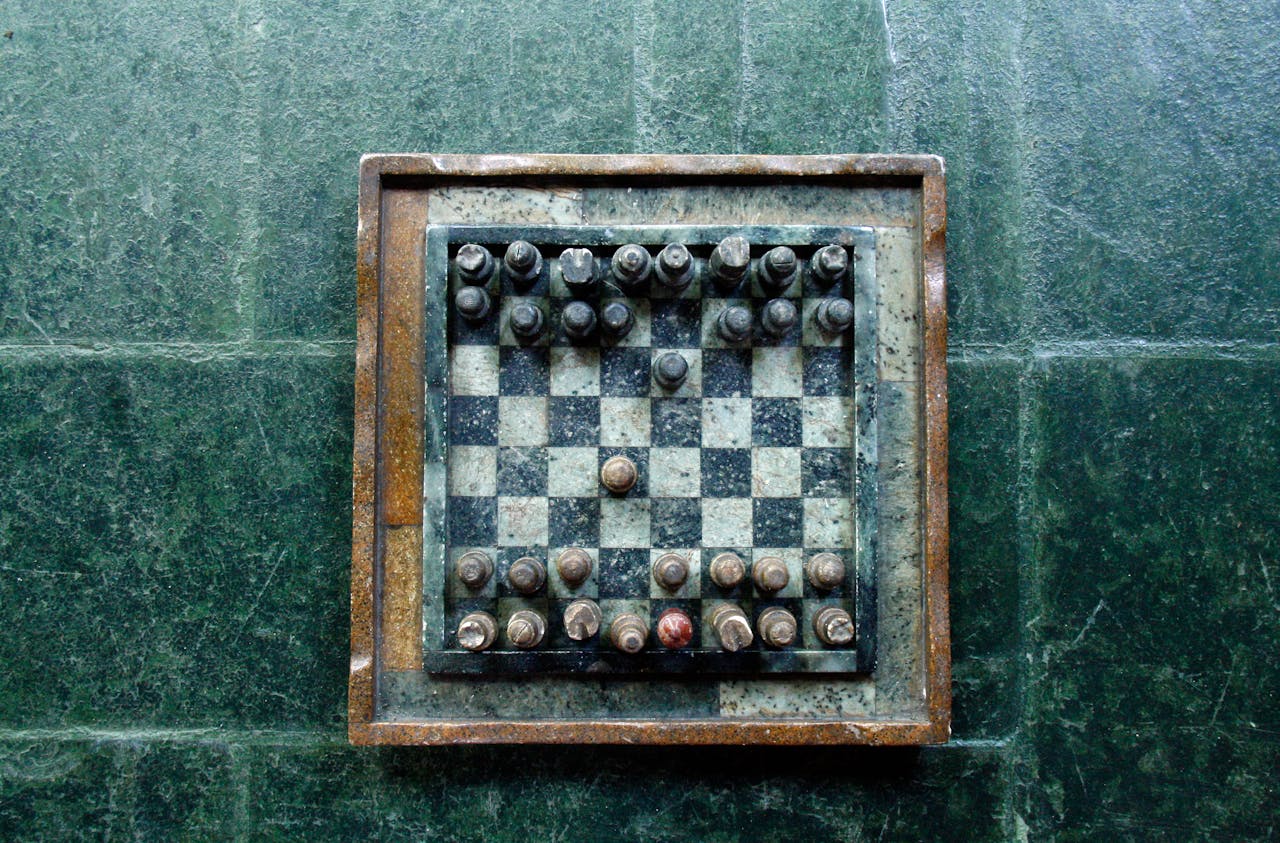 Weathered chess board and game pieces